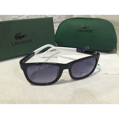 Солнцезащитные очки Lacoste Lux черные c сине-белыми полосатыми дужками 2507