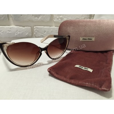 Солнцезащитные очки MIU MIU коричневые 0808S